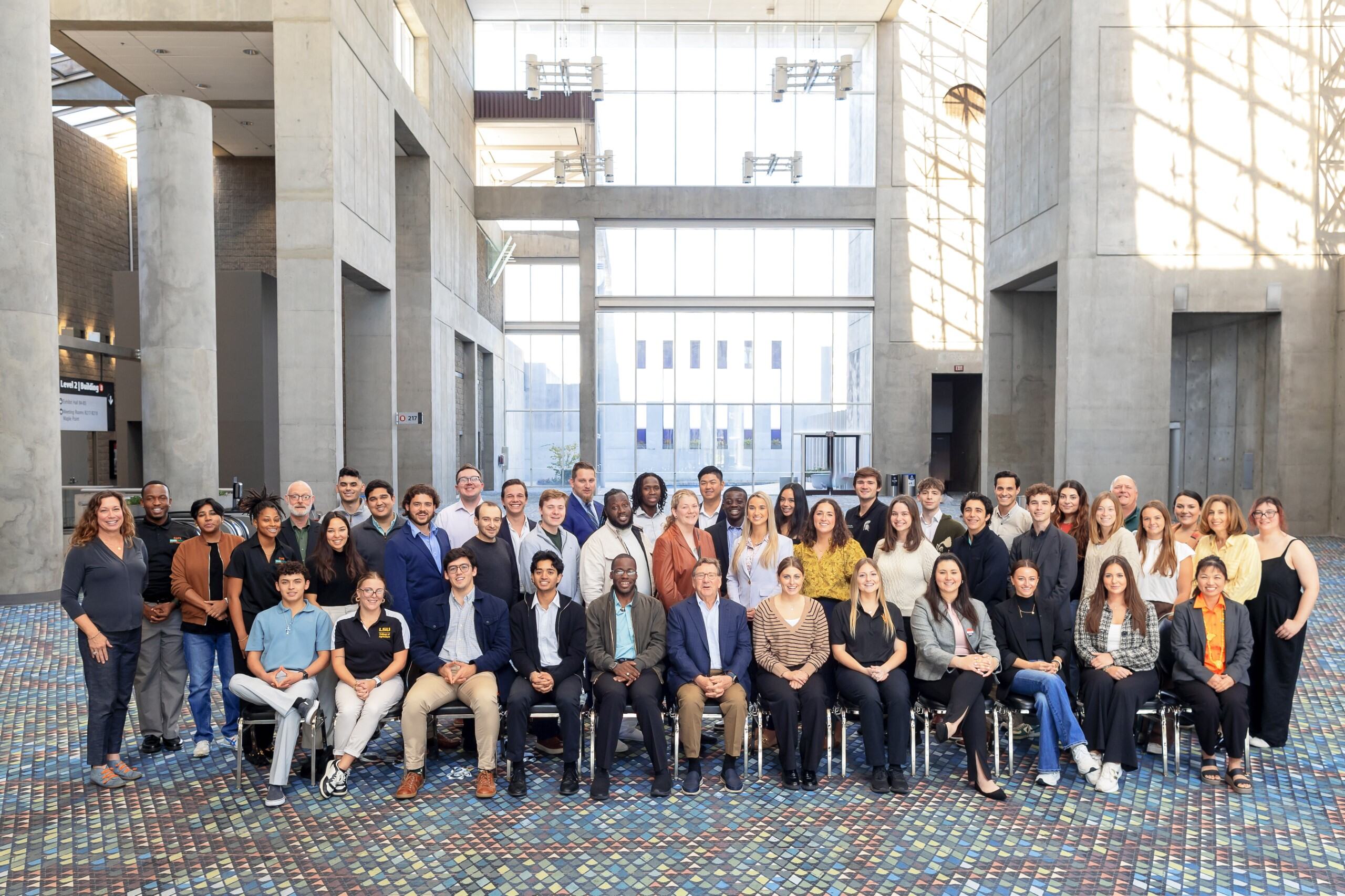 2024 IFPA Jay Pack Award Winners posing and smiling in a group, first row sitting and two rows standing behind