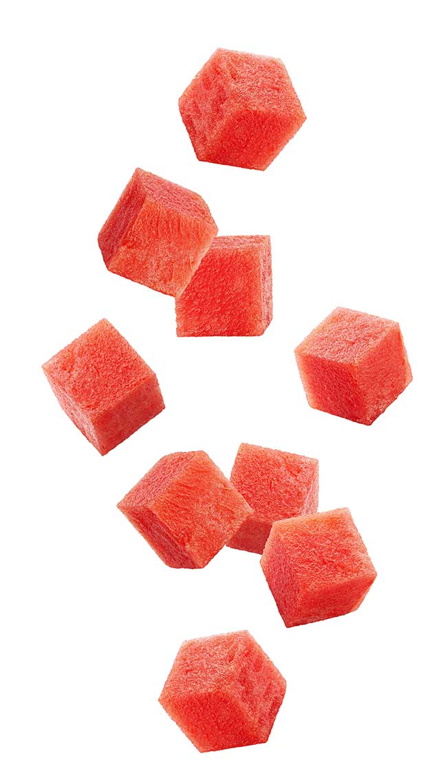 Cubes of watermelon on a white background.