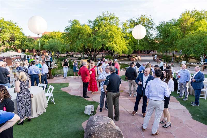 Attendees enjoy a reception outdoors at the 2024 Retail Conference.